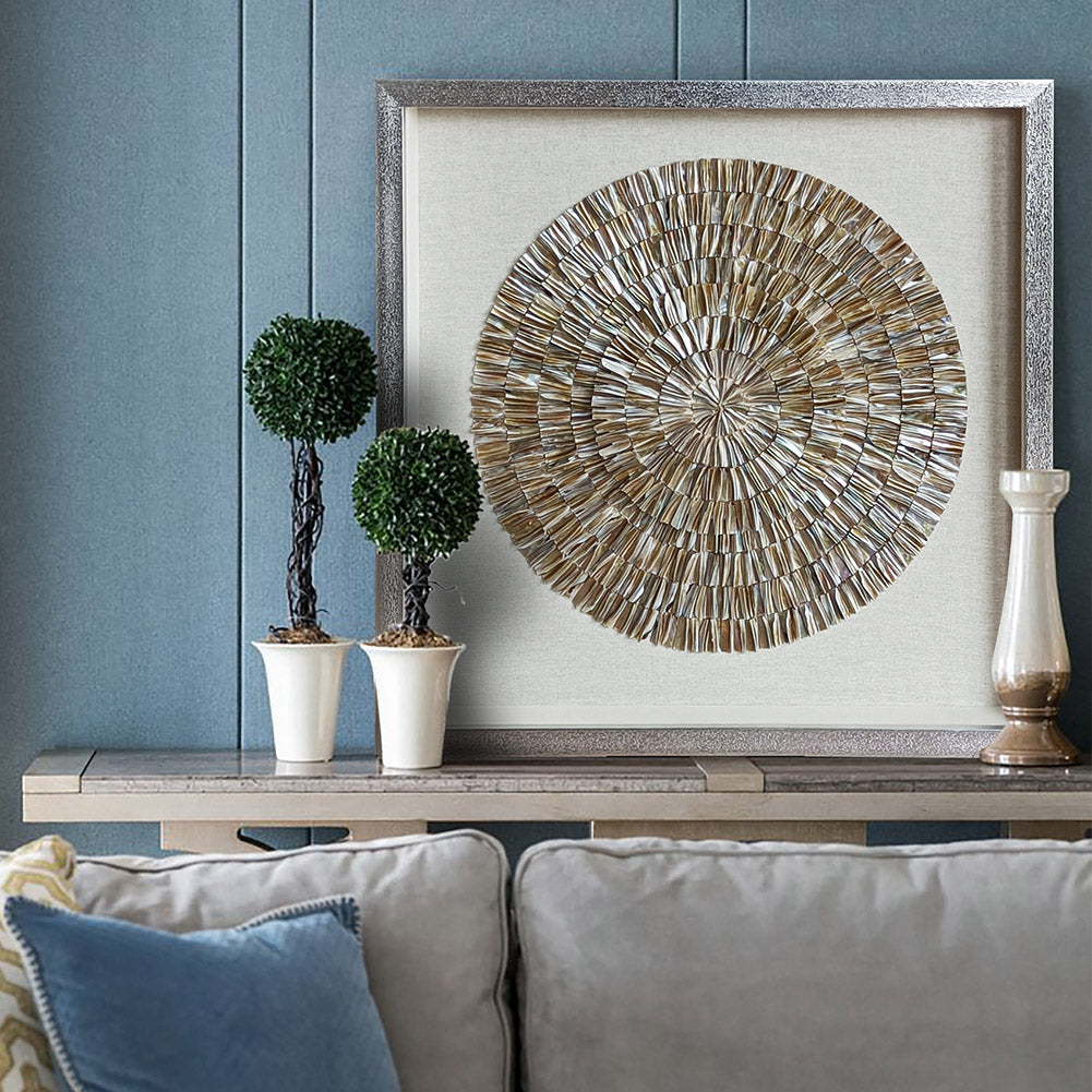 Natural shell radial pattern wall art, warm golden tones on linen mat background